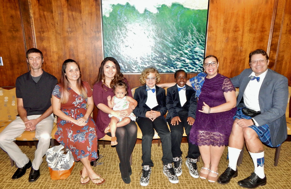 Amanda and Garth Hess with their sons Gregory & Gabrielle (middle to far right) and their guests (left).
